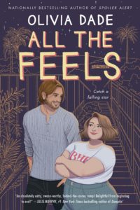 cover of All the Feels: a tall white man with brown hair and facial hair is smiling down at a petite, fat, brown-haired woman. They are standing in front of a purpley bakground with a line drawing of a bridge and palm trees.